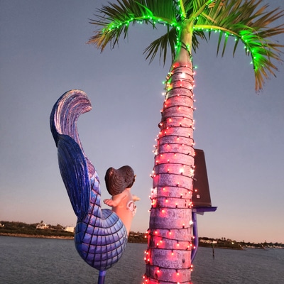 LeBarge-Tropical-Cruises-Mermaid-on-Deck Mermaid with palm tree on boat