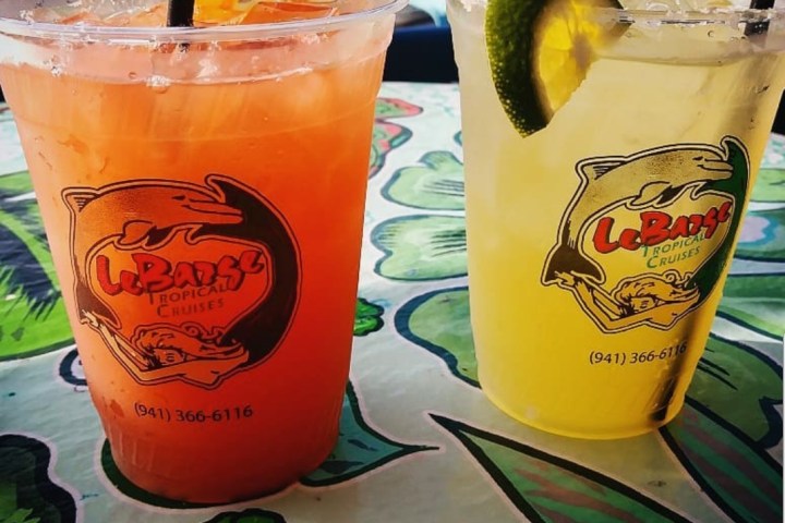 a cup of coffee and a glass of beer on a table