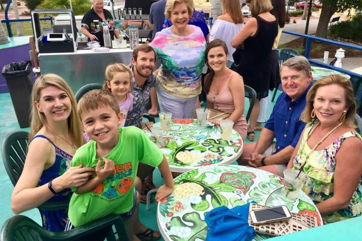 a group of people sitting posing for the camera