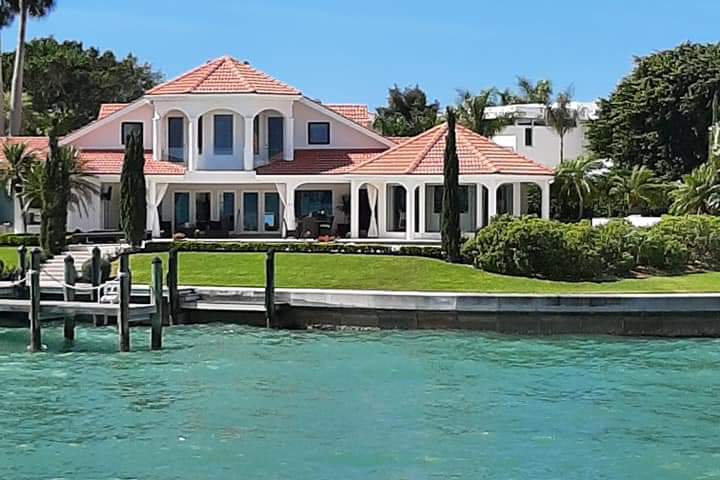 a house next to a body of water