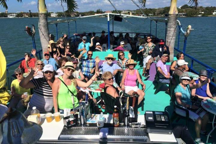 a group of people in front of a crowd posing for the camera