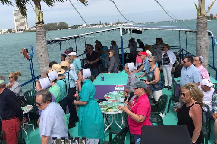 a group of people standing in front of a crowd