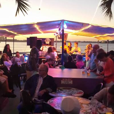 a group of people sitting at a table in front of a crowd