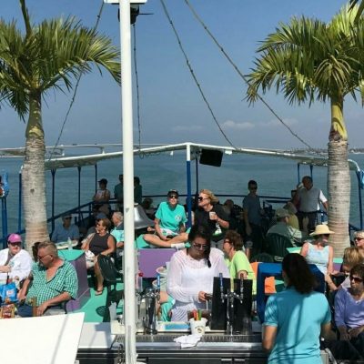 a group of people in a boat on a body of water
