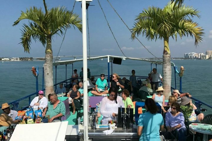 a group of people in a boat on a body of water
