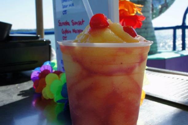 a cup of coffee and a glass of beer on a table